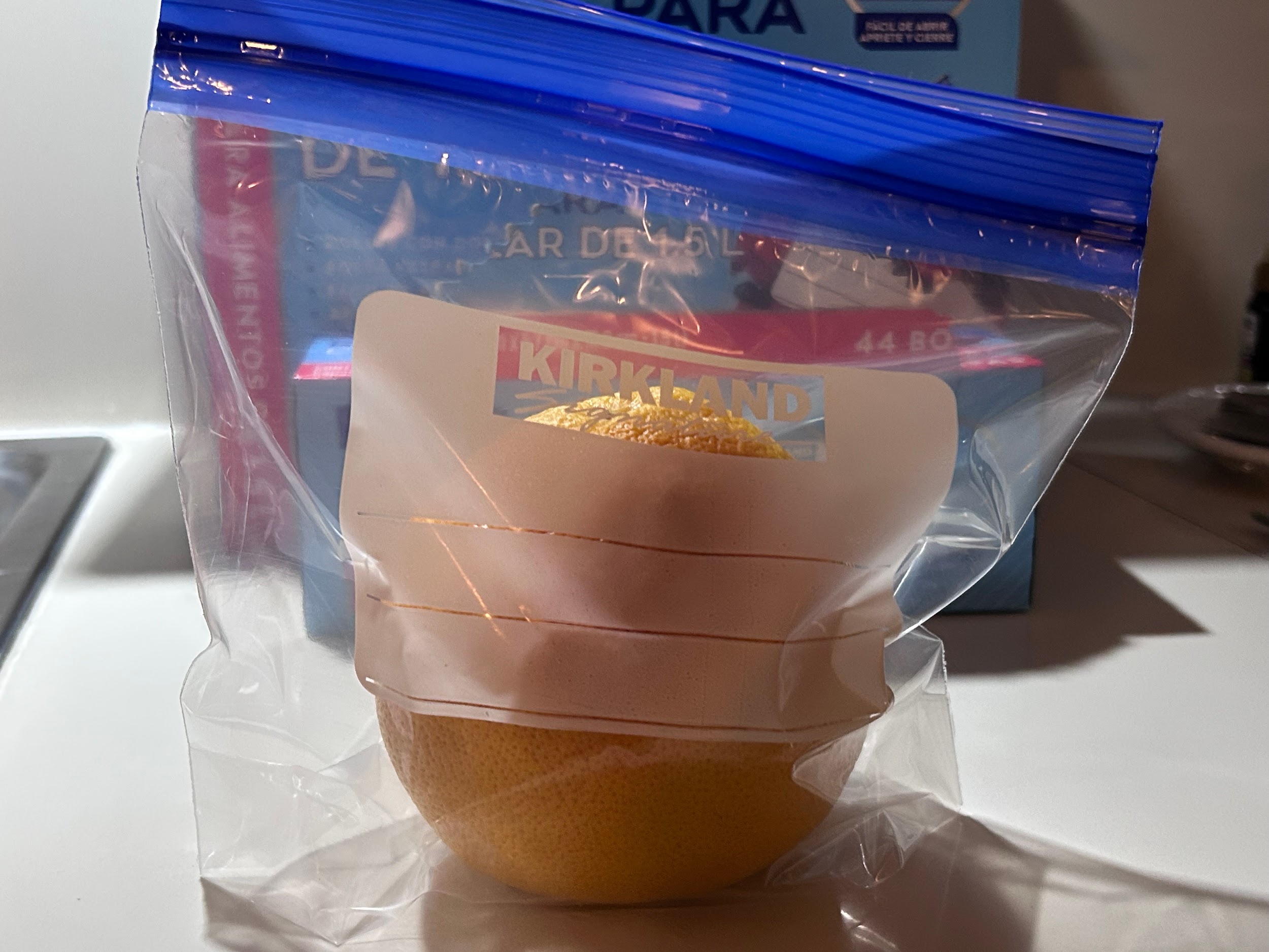 A grapefruit stored inside a Kirkland freezer bag