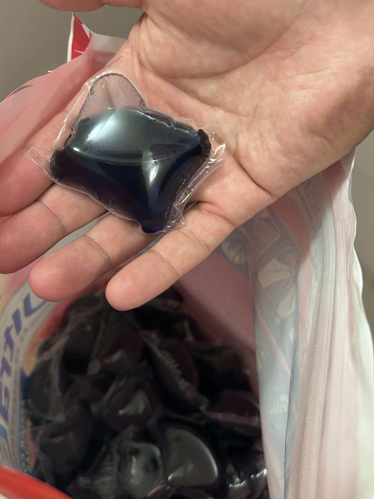 One detergent capsule in hand